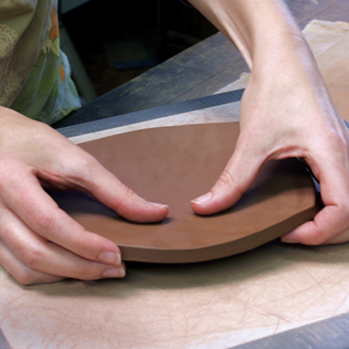 3 Place your fingers under the form, press down in the center with your thumbs. Rotate the form and gently lift all four sides.