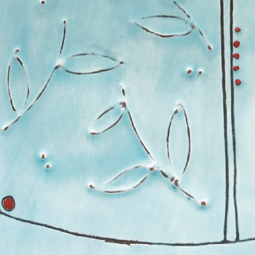 8 Apply 1–2 thin coats of a colored, transparent glaze with a soft, moppy brush, then glaze fire the plate.