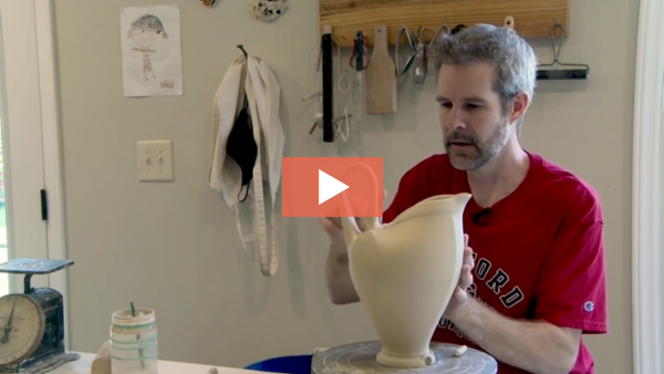 Charlie Tefft fine tunes a handle on a pitcher form.