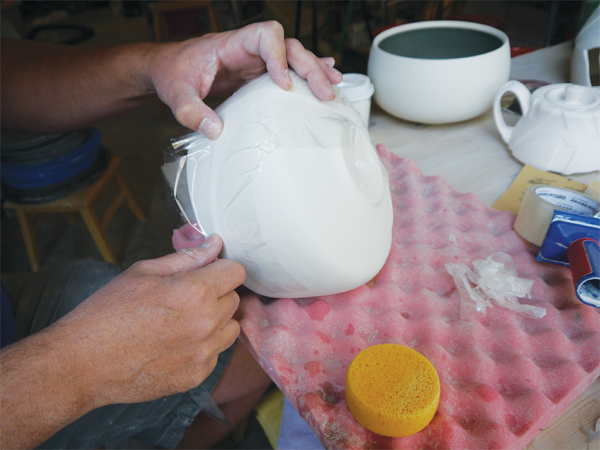 4 Long curves of tape create etched lines that sweep the eye across and around the form.