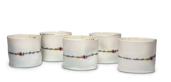 4 Áine McKenna’s Tiny T’s, to 2½ in. (6 cm) in height, porcelain paperclay, celadon glaze, fired to 2300°F (1260°C), ceramic decal, gold luster, 2017. Photo: Peacock Photography.
