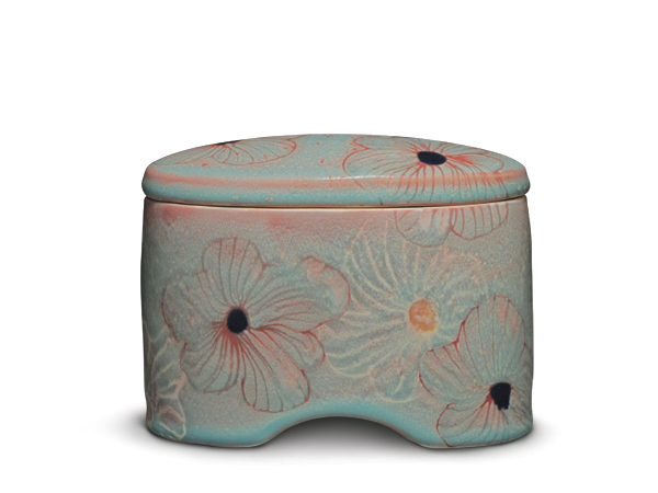 4 Lidded box, 6 in. (15 cm) in height, layered Polseno Turquoise and Polseno Terra Cotta with additional glazes, mid-range white casting slip, fired to cone 5 in oxidation.