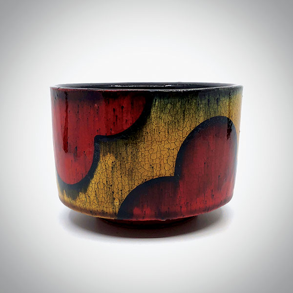 5 Mike Gesiakowski’s red/yellow bowl, 5⅓ in. (14 cm) in width, earthenware, fired to cone 04. 