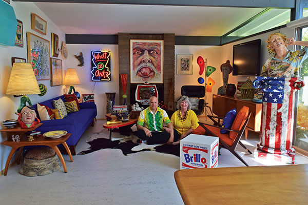 3 Tony Natsoulas and Donna George pictured in the living room of their house with their art collection.