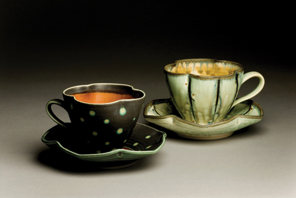 16 Jeff Kleckner’s cups with saucers.
