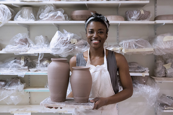 8 Camille Beckles, Kaabo Secretary and Treasurer, with freshly thrown work in her New York City studio.
