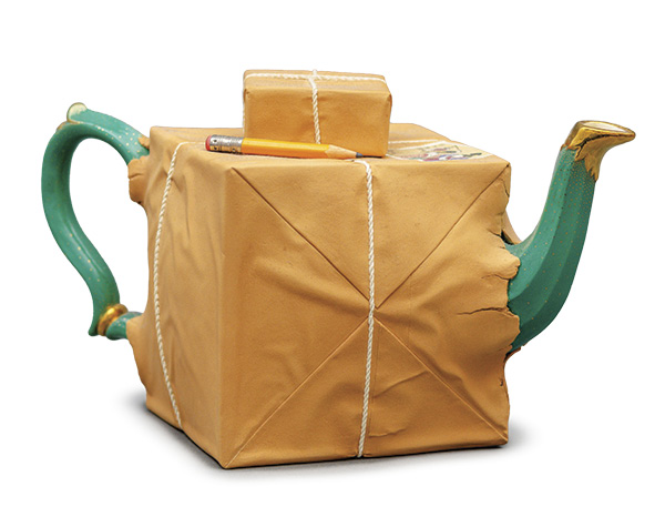 2 Karen Dahl’s Box Too Small Teapot, 10⅝ in. (27 cm) in width, glazed white earthenware, lusters, paint, 2000. Racine Art Museum, Gift of David and Jacqueline Charak. Photo: Jarvis Lawson.