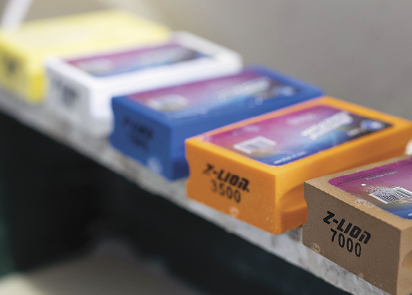 4 Once the marker lines are gone, switch to finer and finer grit diamond pads to achieve a glass-like finish.