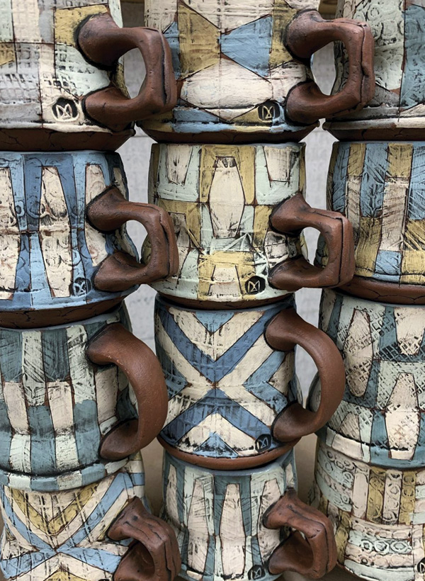 3 Mark Arnold’s mugs, 5 in. (13 cm) in width (each), red clay, Pete Pinnell’s Real Authentic Lip Smackin’ Smooth Easy Terra Sigillata in a variety of color variations, underglaze, glaze, fired to cone 4 in an electric kiln.
