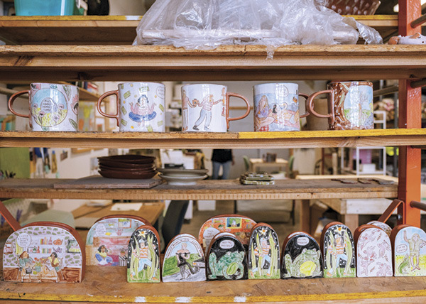 Molly Anne Bishop's finished work on shelves in her studio.