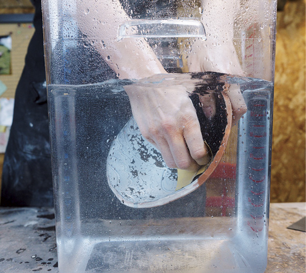2 Gently sand the surface of bowl with 600-grit wet/dry sandpaper until all loose flakes have been removed.