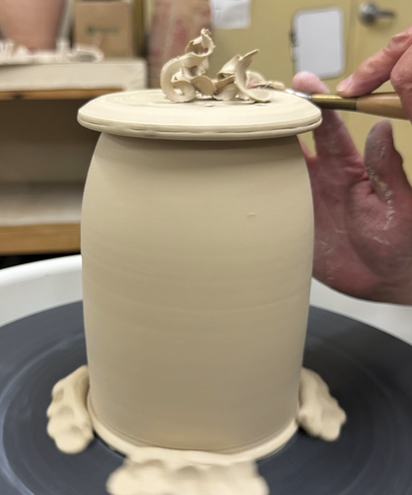 9 Throw a flanged lid and trim it to match the jar.