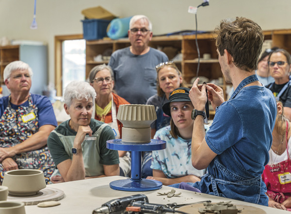 2 Alex Olson teaching his fluting technique during a workshop.