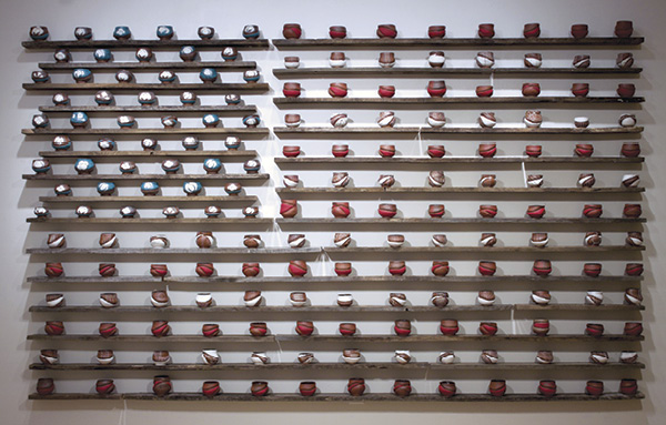 5 Birth of a Nation when Cotton was King, 11 ft. (3.4 m) in length, brown stoneware, slip, fired to cone 5 in an electric kiln, wood, 2021.