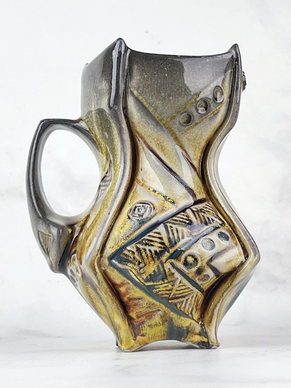 Newman's Skittles and Rainbows Maker’s Mug, 5½ in. (14 cm) in height, Laguna B-mix 10 (porcelaneous stoneware), thin spray of Tenmoku, Galactic Indifference sprayed as a second layer, fired in reduction to cone 12 in a 36-hour wood and soda kiln, 2024.