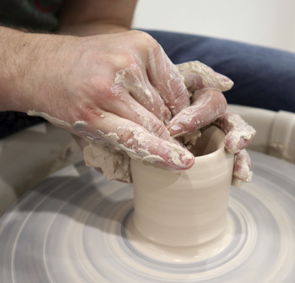 1 Beginning with 1½ pounds (0.7 kg) of clay, throw a thick-walled cylinder with an interior measuring about 1½ in. (3.8 cm) in diameter at the lowest point.
