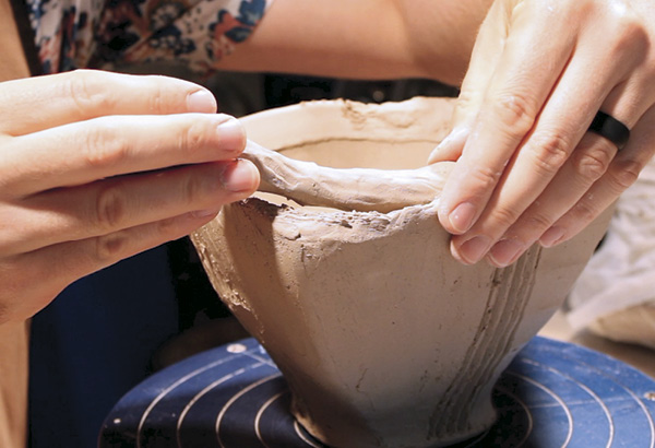 13 Using a coil roughly the thickness of your thumb, reinforce the rim of the bowl where the neck will attach.