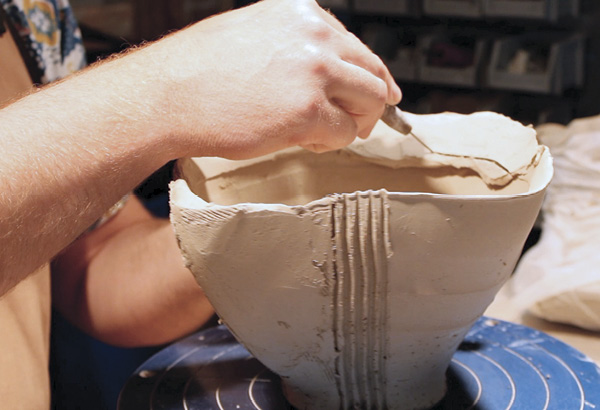 15 Trim any excess clay off the rim using a needle tool or fettling knife.