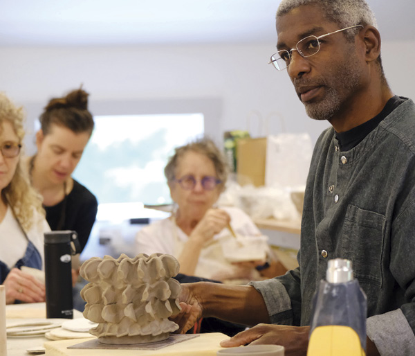 7 Paul S. Briggs at his workshop in the studio during the 2023 season.