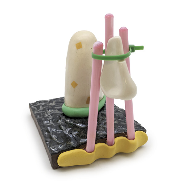 1 Cindy Leung’s To Indulge, 4½ in. (11 cm) in width, porcelain, brown stoneware, epoxy, glass, gold decals, zip tie, 2023.