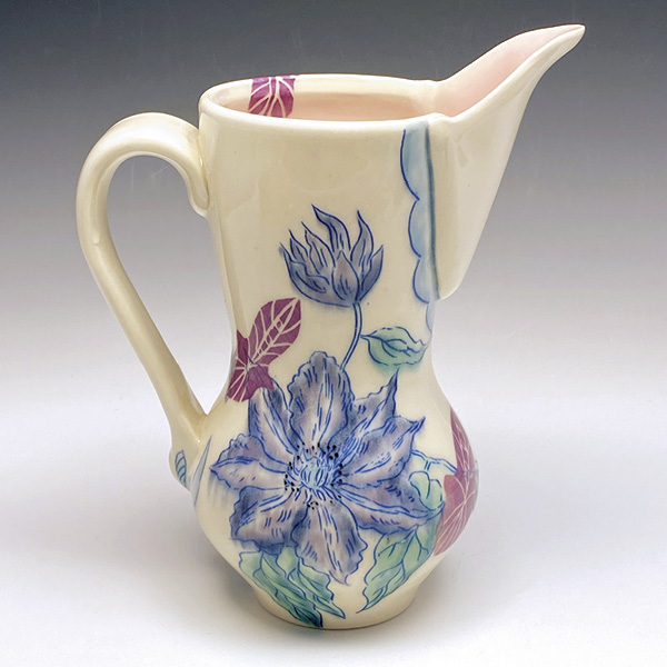 2 Asta Bubliene’s Clematis Pitcher, 9 in. (23 cm) in height, porcelain, underglaze inlay, paper resist, sgraffito, underglazes, glazes, fired to cone 6 in oxidation, 2023.