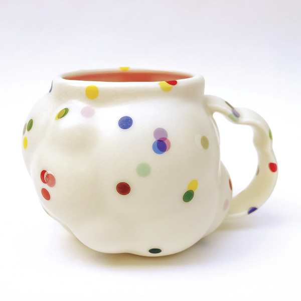 4 Nate Ditzler and Laura Konecne’s Confetti Series: Large Cloud Mug, 5¾ in. (15 cm) in width, translucent pigmented porcelain, glaze, overglaze, fired to cone 6 in oxidation, 2023.
