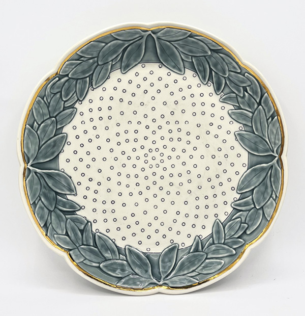 5 Alison Lowery’s serving platter, 11½ in. (29 cm) in diameter, porcelain, slip, underglaze, glaze, gold luster, 2024.