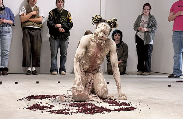 1 Va-Bene Fiatsi’s (known as ‘crazinisT artisT’) Who Heals the Healer?, performed at the University of Arkansas, in 2024.