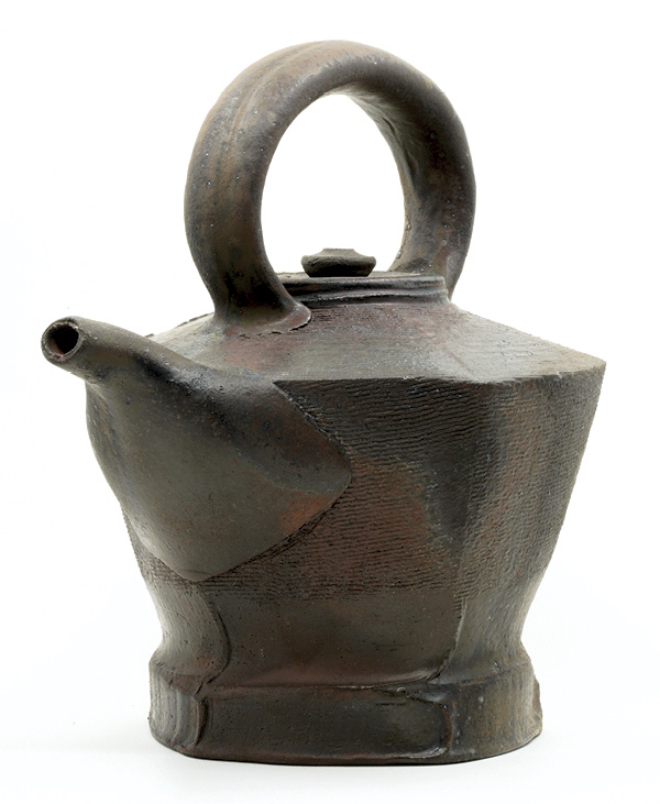 Josh Scott's Kettle teapot, 8 in. (20.3 cm) in height, iron-rich stoneware, various high-iron slips, fired to cone 8–10 in a wood kiln, reduction cooled to around 1450°F (787.8°C).