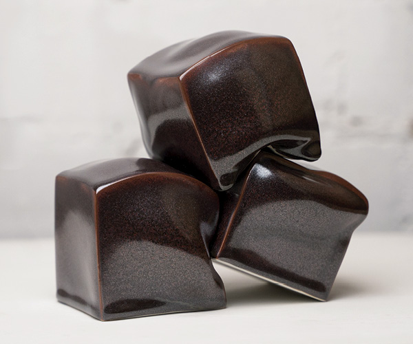 1 Terzett, 3½ in. (9 cm) in height (each cobble), slip-cast and altered porcelain, tea-dust glaze, individually fired in a gas kiln, balanced for installation, 2022. Photo: Sebastian Weindel.