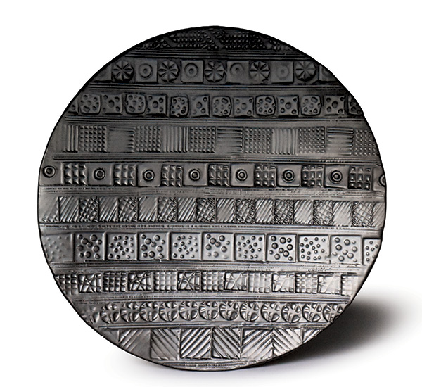 4 Platter, 25 in. (46 cm) in diameter, handbuilt stoneware, stamped pattern, matte-black glaze, fired to cone 10 in reduction.