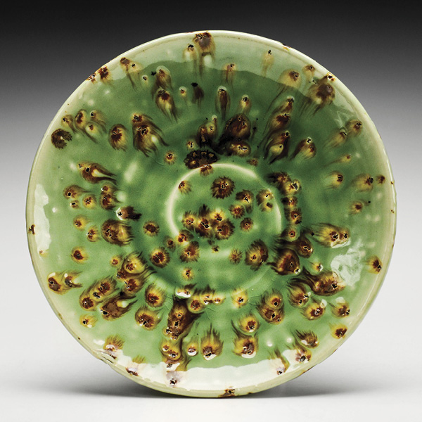 2 Anthony Schaller’s plate, 7 in. (17.8 cm) in diameter, wheel-thrown white stoneware, iron flakes, fired to cone 10, 2025. Photo: Lauren Kemp.
