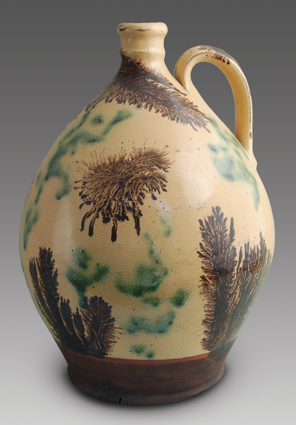 7 Wisconsin Pottery’s jug with yellow background slip, brown dendritic pattern, and random green copper oxide pattern, 9½ in. (24 cm) in height, fired in oxidation to cone 04. Photo: Courtesy of Wisconsin Pottery.