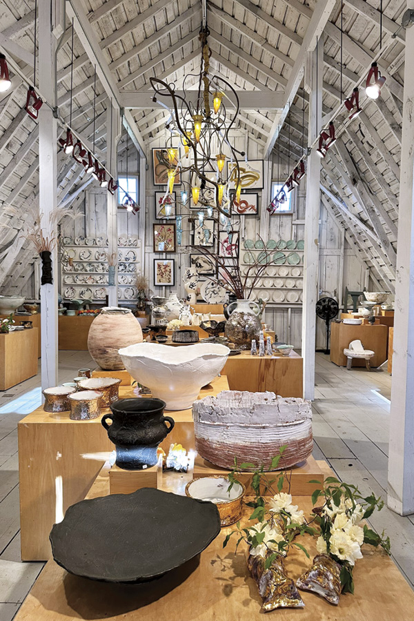 4 High-vaulted ceilings open up the space in Kasten’s gallery and showroom on the upper level of the barn.
