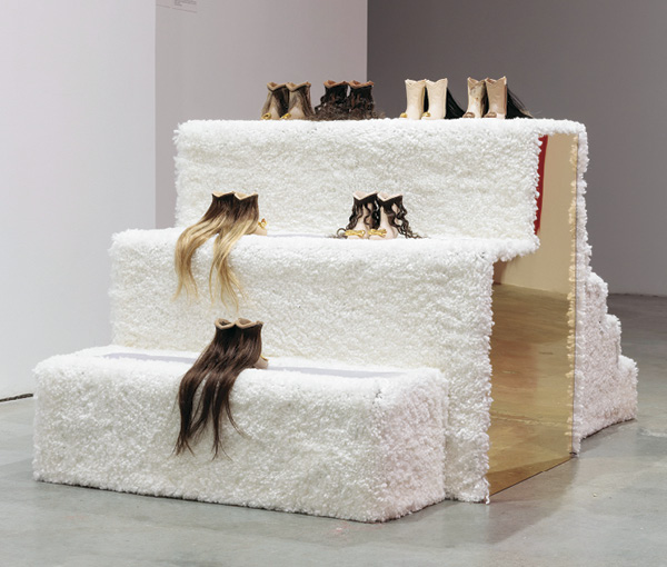 8 Jennifer Ling Datchuk’s Moving on Up, 36 in. (91.4 cm) in height, Laguna Clay Company porcelain doll slip colors, gold luster, human hair, carpet, wood, mirrored acrylic, carpet protector, 2023.