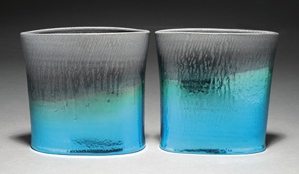 3 Tom Marino’s Horizon Series: Earthrise, 9 in. (22.9 cm) in height, porcelain, black glaze, fired to cone 10 in heavy reduction, metallic silver, sealed with a blue and green coating, 2024.