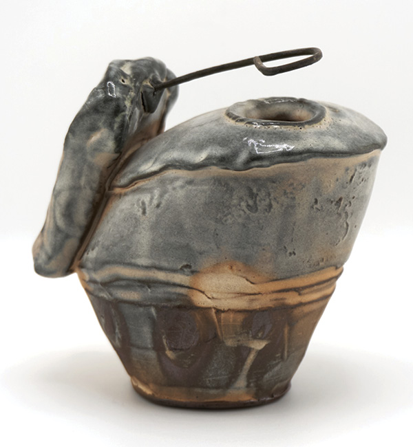 1 Heather Lepp’s vase, 4 in. (10 cm) in height, wheel-thrown and assembled earthenware, white slip, fired to cone 3 in a soda kiln.