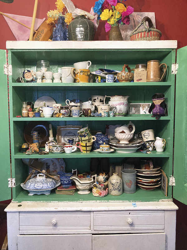 3 An array of ceramics and objects that Sims or her kids either made or found, on display in her home.