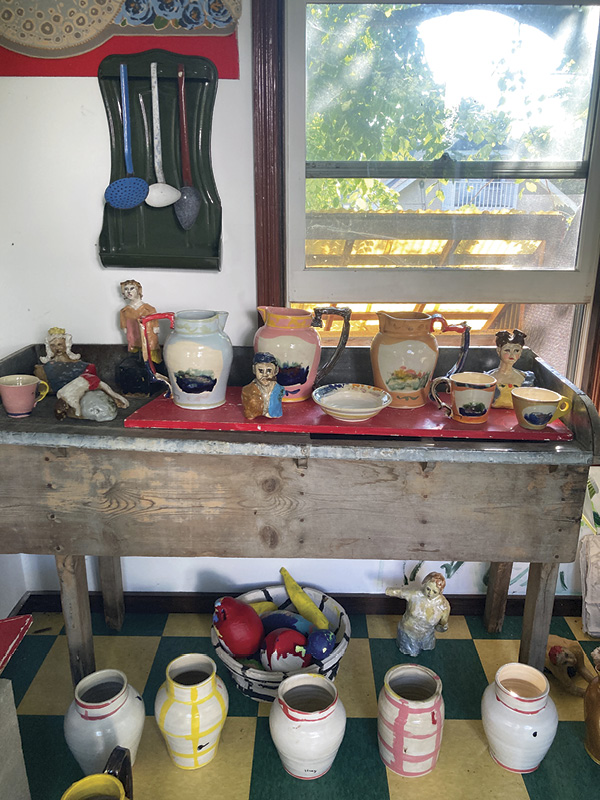 5 Sims’ backyard showroom, filled with ceramic objects and sculptures from her travels.