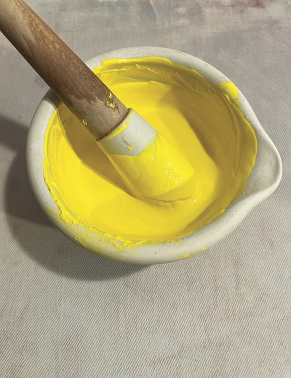 1 To create the colored clay, start by placing the stain in a mortar and pestle and add water until it’s a paste.