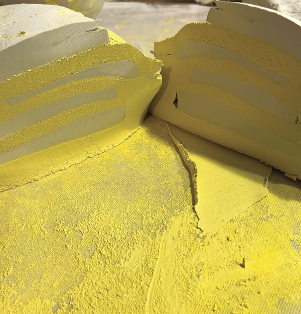 6 Combine the stained clay with the remaining clay by slap wedging, layering cross-sections then cutting the stack in half, slamming together, and repeating until blended.
