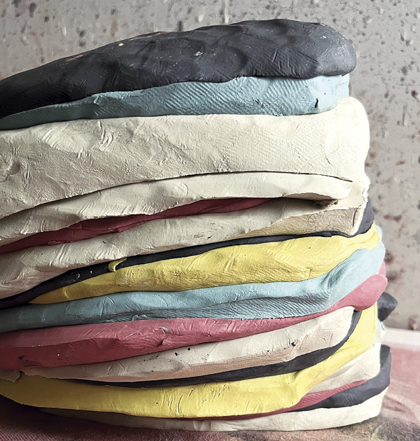 8 Cut cross-sections of each color of clay and then slam them together to combine and minimize air pockets.