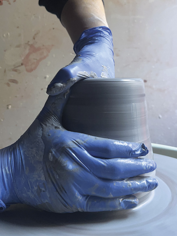 11 Wear gloves while throwing to prevent heavy-metal poisoning. While centering and throwing, the colors will blend together on the surface.