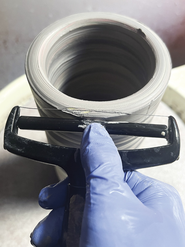 14 To create the facets, start at the top of the cylinder and drag the cheese slicer down quickly without stopping.
