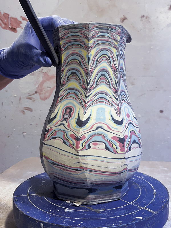 22 Score and slip both the top of the handle and the pitcher.