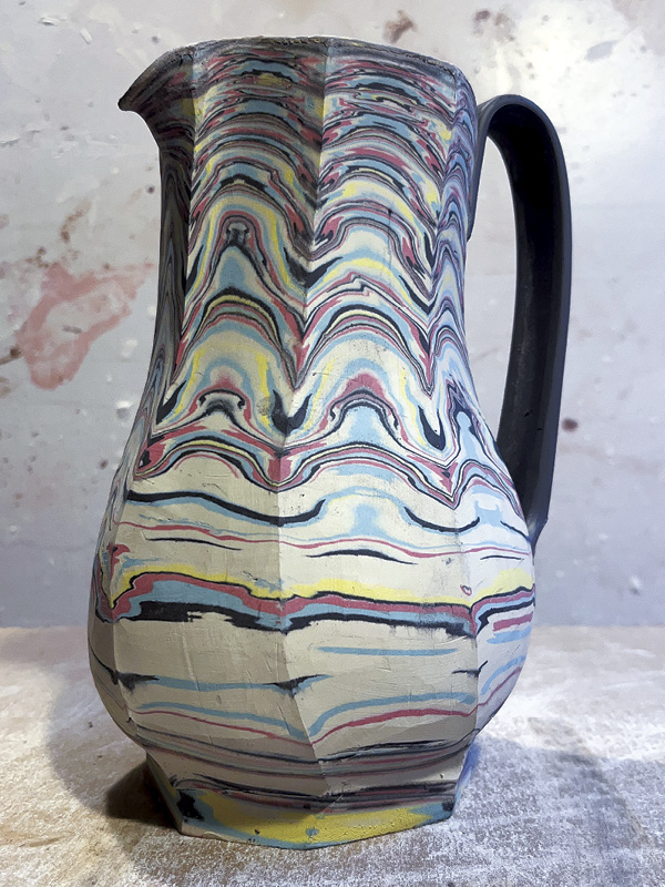 25 Completed faceted agateware pitcher.