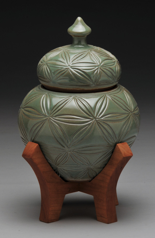 2 Bradley Keys’ Home (Kumiko Ginger Jar with Oak Hexagonal Stand), 12½ in. (32 cm) in height, hand-carved stoneware, oak, 2026.