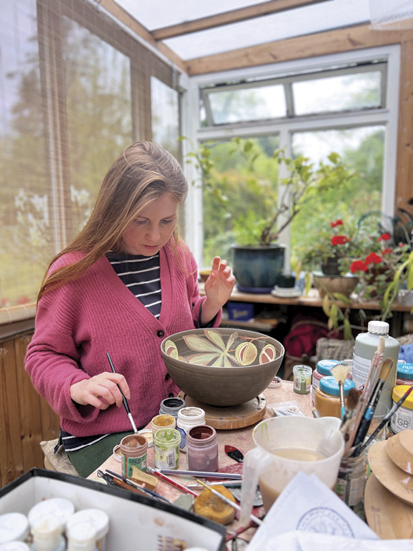 15 Using a variety of underglazes, Sampson decorates her vessels with flora and fauna imagery.