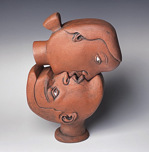 2 Cynthia Consentino’s The Kiss, 17 in. (43 cm) in height, slab-constructed terra cotta, stains, underglaze, fired in an electric kiln, 2022.