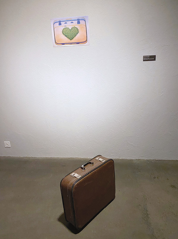 10 Razalina Busel’s Baggage, 20 in. (50 cm) in length, porcelain, leatherette suitcase (ready-made), 2021–2022. Photo: Yauheni Hlushan.